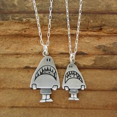 This cute set is a fun gift for your friends with kids. They are made from sterling silver, the mom measures 3/4" high and the daughter 1/2" high.  The daughter hangs from a 16" silver-plated cable chain and the mom hangs from an 18" silver-plated cable chain.If you have two kids:https://www.etsy.com/listing/87244713/two-kids-famiy-necklaceTo see the larger necklace click here:https://www.etsy.com/listing/517944382/sterling-shark-girl-necklace-cute-silverTo see the smaller necklace click here:ht Cute Sterling Silver Pendant Charm Necklace, Cute Silver Sterling Silver Charm Necklaces, Cute Sterling Silver Pendant Charm Necklaces, Playful Silver Jewelry For Friendship, Fun Silver Jewelry For Friendship, Fun Nickel-free Jewelry For Friendship, Cute Nickel-free Charm Necklace For Friendship, Handmade Cute Charm Necklaces For Mother's Day, Playful Silver Charm Necklaces