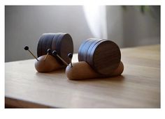 two wooden objects sitting on top of a table