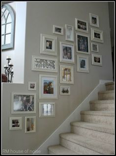 a staircase with pictures on the wall next to it and an email message below that reads, visit