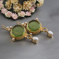 ✽ D E T A I L S   {Gemstone} - Green Glass   {Gemstone Size} - 18 mm    {Earring Height Including Hoop} - 5.5 cm   {Earring Width} - 2.8 cm   {Finish} - Smooth and high polished with brilliant shine.   {Note} -The earrings are made to order, production day is about 3-5 working days. The one you receive may be slight different from the one                  in the picture due to handmade nature, but it will be almost same as in the above picture.    These pieces are handcrafted from start to finis Green Elegant Drop Earrings, Ornate Gemstone Earrings For Wedding, Green Fine Jewelry Earrings For Celebration, Green Fine Jewelry Earrings For Wedding, Green Pierced Bridal Earrings For Wedding, Elegant Green Round Bridal Earrings, Green Round Pearl Drop Earrings, Green Pearl Drop Round Earrings, Green Round Chandelier Earrings As Gift