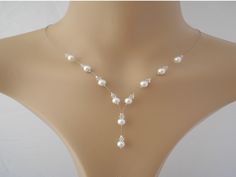 Stunning dainty pearl and crystal drop necklace Handmade to order using 6mm Preciosa* Pearls and 4mm clear crystals crimped onto fine silver or gold coloured jewellery wire (also available on clear illusion cord) The necklace will be made to your chosen length which does not include the drop Find your perfect necklace length: Step 1: Use a string to mark the spot you would like your necklace to hang (not including the drop) Step 2: Measure the strings length with a ruler or tape measure Pretty o Coloured Jewellery, Jewellery For Wedding, Diy Hair Accessories Tutorial, Hair Accessories Tutorial, Wire Jewelry Patterns, Dainty Pearl Necklace, Bridal Statement Earrings, Jewellery Wire, Pearl Drop Necklace