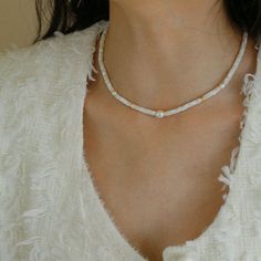 Indulge in the enchanting beauty of our White Mother of Fritillary Pearl Necklace—a masterpiece of craftsmanship featuring exquisite 18K gold-plating. Meticulously crafted from high-quality copper, adorned with freshwater pearls, and accentuated by the timeless allure of white mother-of-pearl, this necklace is a true embodiment of sophistication. Key Features: Lustrous 18K Gold Plating: Immerse yourself in the radiance of our necklace, boasting an opulent 18K gold-plated finish. The meticulous p Geometric Type, Pearls Necklace, Gemstone Beaded Necklace, Mother Of Pearl Necklace, White Butterfly, Feather Light, Mother Pearl, Recycled Gold, Keep Jewelry