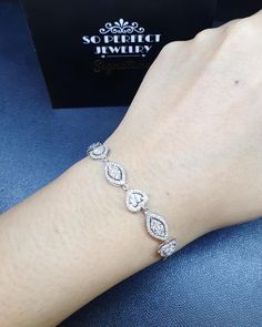 A delicate high-end luxury fine earth mined natural WHITE diamonds, in MODERN STYLE, bracelet handmade from solid 18K White gold. This elegant and oh so pretty bracelet is a timeless piece and is in BRAND NEW condition. With 186 pieces of EXTREMELY WHITE diamond, TOP sparkling, and CLEAN quality. And wraps the wrist perfectly. It is so delicately made and feels so lovely on, you forget you are wearing it - until someone reminds you, it certainly gets A LOT OF ATTENTIONS! The bracelet contains 18 Exquisite Cubic Zirconia Bangle Bracelet, Sterling Silver Bracelet For Anniversary, Exquisite White Gold Bangle Bracelet, Elegant White Gold Bracelets Fine Jewelry, Exquisite Cubic Zirconia Diamond Bangle Bracelet, Timeless Sterling Silver Wedding Bracelets, Timeless Sterling Silver Bracelets For Wedding, Fine Jewelry Diamond White Bracelet For Anniversary, Anniversary Fine Jewelry Bracelet In Diamond White