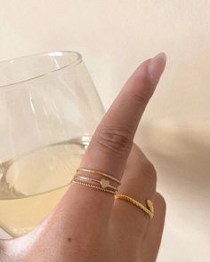 Featuring a dainty stacking ring with a twisted rope design. Made in 14k gold-fill, she's tarnish-resistant, showerproof, and safe for sensitive skin. Just keep her away from chemicals such as hand sanitizer, soap, and lotion. She looks beautiful stacked or as a solo ring. …………………………………. D E T A I L S • Available from US 5 to 9• Width measures 1mm• Keep away from chemicals such as lotion, soap, and hand sanitizer• Tarnish-resistant, waterproof, and safe for sensitive skin • 100% 14K Gold Filled Teen Ring, Multiple Rings, Soft Toothbrush, Gold Ring Stack, Rope Design, Jewelry Lookbook, Tiny Heart, Dream Jewelry, Dainty Ring