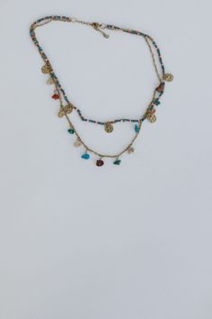 This head-turning Cova Necklace is perfect for all your boho ensembles and will add a touch of playful charm! Stunning short necklace style with 2 unique layers First layer has playful mix of seed beads and charms Second layer has gold chain with so cute stone bead charms Playful mix of colors for added boho style Classic lobster claw closure with a 2" extender Pair with: High Neck Racerback Brami, Offshore Patchwork Detail Pants and Shoreline Platform Sandals. *Due to lighting and differences i Boho Essentials, Moon Collection, Short Necklace, Style Classic, Sock Shoes, Hair Jewelry, Lobster Claw, Platform Sandals, Stone Beads