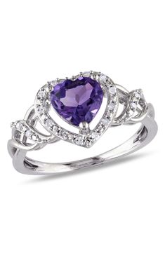 Diamonds frame an elegant heart shaped amethyst that crowns this dazzling ring. 0.41" band width Sterling silver/amethyst/diamond Imported Elegant Heart-shaped Amethyst Ring, Purple Heart Amethyst Ring With Accent Stones, Elegant Purple Heart Promise Ring, Elegant Heart-shaped Amethyst Ring For Valentine's Day, Purple Amethyst Ring For Valentine's Day, Purple Amethyst Heart Cut Ring For Valentine's Day, Elegant Amethyst Heart-shaped Birthstone Ring, Elegant Purple Heart Ring For Anniversary, Purple Heart Ring For Valentine's Day