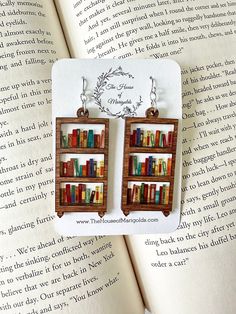 Book Earrings| Bookshelf Earrings| Reader Gifts| Book Earring Dangle| Book Club Gifts| Librarian Gift by thehouseofmarigolds on Etsy https://www.etsy.com/listing/1415975635/book-earrings-bookshelf-earrings-reader Bookshelf Earrings, Book Club Gifts, Reader Gifts, Ears Pierced, Gifts Book, Weird Jewelry, Book Earrings, Bookclub Gifts, Earring Dangle