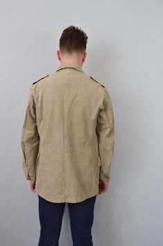 "Vintage Stone Canvas Chore Worker Jacket - 100% Cotton Tough Faded Military - S M L XL Rugged tailored military design in a stunning faded stone wash grey/desert brown canvas fabric that makes the perfect midweight jacket. Metal buttons, two front pockets and epaulettes to shoulders. Most will not be decorated but there may be a few with badges to collar or chest which can be easily removed if desired. - Original Swedish tagging within - Unlined - Dated 1950s-60s - Made from thick, durable cott Vintage Khaki Cotton Blazer, Vintage Khaki Sport Coat For Work, Vintage Khaki Blazer With Pockets, Vintage Khaki Winter Blazer, Vintage Khaki Single-breasted Sport Coat, Vintage Single-breasted Khaki Sport Coat, Vintage Khaki Sport Coat With Buttons, Military Style Khaki Sport Coat With Button Closure, Khaki Military Sport Coat With Button Closure