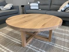 a living room with two couches and a coffee table in the middle of it