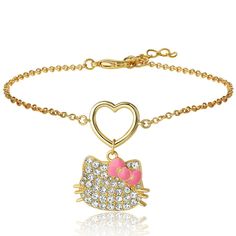 a hello kitty bracelet with pink and white crystals on the clasp, in gold tone