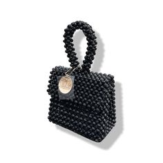 Artisanal Bead Bag.Designed in NYC. Crafted with precision in the heart of Lagos, Nigeria.Introducing our exclusive bead bags – the epitome of timeless elegance and craftsmanship. Chic, streamlined, and adaptable, these handbags are designed to be your enduring companions. Effortlessly blending style and durability, our bead bags transcend trends, seamlessly complementing cocktail dresses, casual denim and tees, professional attire, and becoming the perfect accessory for a night out on the town. Bead Bag, Lagos Nigeria, Professional Attire, Bag Light, Detail Shop, Beaded Bags, Casual Denim, Contemporary Fashion, Jewelry Bags