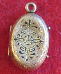 "An Awesome 1890's Victorian 14 Karat Yellow Gold Locket With Photos Necklace Pendant. Visit our shop for awesome retro photos, vintage jewelry, sports memorabilia and home decor. Size: 1/2\" across x 3/4\" high Material: 14 Karat Yellow Gold Condition: Good. Front Is Bowed In. Photos Show Wear. Year: 1890's Signed: Unsigned. Inventory #: 2280" Antique Pendant Locket Necklace With Vintage Charm, Collectible Ornate Pendant Locket Necklace, Ornate Pendant Locket Necklace Collectible, Ornate Pendant Locket Necklace For Collectors, Victorian Medallion Locket Necklace With Vintage Charm, Engraved Gold Jewelry For Vintage Events, Gold Engraved Jewelry For Vintage Events, Vintage Locket Pendant Jewelry, Vintage Pendant Locket Jewelry