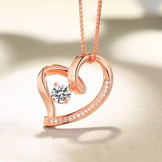 On Valentines Day, there is nothing more meaningful than a heart pendant with a birthstone. It is a truly great gift to express your love to your dearest one. The necklace is made of .925 sterling silver with a gem on the middle which can be personalized with a birthstone of your choosing. The Love In Your Heart Personalized Pendant Necklace arrives with a velvet jeweler's pouch and presentation box, perfect for safekeeping or gift giving. Celebrate the eternal nature of true love with this excl Heart-shaped Cubic Zirconia Birthstone Necklace, Heart-shaped Birthstone Necklace In Cubic Zirconia, Elegant Gemstone Heart Necklace For Anniversary, Heart Cut Gemstone Birthstone Necklace Gift, Anniversary Heart Pendant Necklace With Gemstone, Gift Heart Cut Gemstone Birthstone Necklace, Anniversary Gemstone Heart Pendant Necklace, Gemstone Heart Pendant Necklace For Anniversary, Heart Cut Birthstone Necklace As A Gift