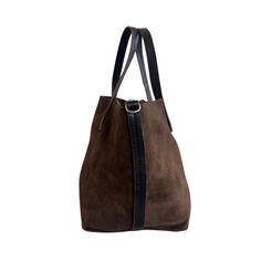 Soft, thick Argentinian small suede leather tote bag with short strap that sits under the arm. This tote style leather bag features an interior removable pouch which sections the bag, and a pocket. Contrasting leather strap detail. This tote is available in 3 colors. - Measures 8”H X 13 1/2”W X 7” D- 5” Handle Drop Inside pouch- 7 1/2”H X 12” X 5”D - 45” extra long strap . Suede Tote, Leather Tote Bag, Extra Long, Leather Tote, Suede Leather, Leather Straps, Leather Bag, Pouch, Tote Bag