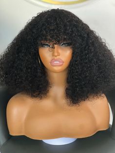 Discover the elegance of our Luxury Black Bangs Curly Wig. Made from high-quality human hair, this super full fringe wig features luxurious, soft curls that add a stylish touch to any look. Designed for convenience, it's a glueless wig with adjustable straps and combs for a secure fit.     Care And Maintenance      It's a Water 💦 friendly wig! Comb out with a wide tooth comb, wet the wig with water , apply a leave in conditioner, light serum and mousse preferably ;Brush out the curls.  Allow to Bangs With Curls Wig, Curly Wig With Bangs Black Women, Full Fringe Bangs, Curly Black Wig With Bangs, Black Wig Bangs, Long Black Wavy Hair With Bangs, Black Bangs, Curls Wig, Fringe Wig