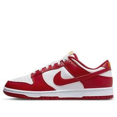 Introducing the Nike Dunk Low Retro 'Gym Red' USC - the must-have sneaker for fans of the University of Southern California Trojans. Perfectly crafted to be worn on and off the court, this basketball icon presents a modern take on tradition. Constructed with high-quality materials, such as leather for the upper, rubber for the outsole, and a suede Swoosh, this durable design ensures that you won’t have to worry about sacrificing your style for longevity. The athletic colorway features hues of white, gym red and yellow evoking a sense of power and pride – ideal for those game day spectacles. Plus, bright yellow Nike branding finishes off what will be an unforgettable addition to any Nike collection. So why not put some team spirit into your step and rep your Trojans with these classics kick Nike Dunk Low University Red, Red Dunks, Vapormax Plus Black, Nike Dunk Low Sp, White Gym, Nike Air Vapormax Plus, Nike Models, Shoe Display, Nike Sb Dunks