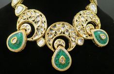 This beautiful choker is a modern twist to traditional jewelry and comes in a gold finish with green stones to match any outfit as desired. The choker is made of high quality stones and is a statement piece that can be dressed accordingly. The set comes with matching earrings for a complete look. Beautiful Chokers, Green Stones, Bollywood Jewelry, Authentic Indian, Indian Wedding Jewelry, Emerald Necklace, Gold Choker, Pearl Set, Traditional Jewelry