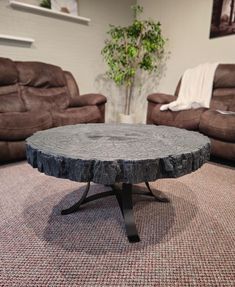 a living room with two couches and a coffee table in the middle of it