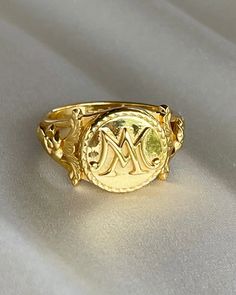 The Marie Antoinette Ring her monogrammed rIng MA, she was the queen of France brfore the French Revolution.  This beautiful ring made of 18k gold plated silver and inscribed inside Eat Cake. All items come in a gift box ready to gift. To see more please visit my Etsy shop at https://www.etsy.com/shop/BijouLimon Bijou Limon jewelry collections present a romantic French spin on the latest jewelry trends. Based on the US West Coast but French at heart, Bijou Limon interprets the current jewelry tr Marie Antoinette Jewelry, Vintage French Wedding, Rococo Jewelry, Wax Seal Ring, French Queen, Queen Of France, Jewelry Wax, Latest Jewellery Trends, Seal Ring