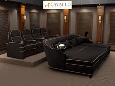 a room with black couches and gold trimmings in front of a sign that reads cavallo