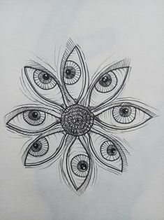 a drawing of an eyeball with leaves and petals on the bottom, in black ink