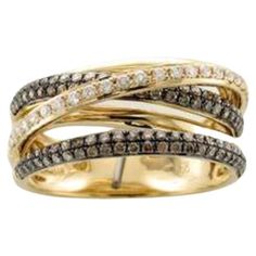 two tone gold ring with brown and white diamonds on the sides, set in 18k yellow gold