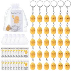 a bunch of little yellow chicks are in front of a clear bag and some key chains