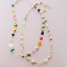 The Mariposa Beaded Necklace is fun personified. This multicolored, beaded necklace is sure to make you smile. This necklace is handmade using an assortment of beads including Czech glass and gemstone beads on a single strand of colorful loveliness! While each bead might have a different color, consistency, pattern, texture and shape, they are all separated by a cylindrical golden bead. This allows for you to really be able to see the unique beauty of the necklace and still have unity in the des Colorful Fun Beaded Necklaces With Round Beads, Playful Beaded Necklaces With Colorful Beads For Gifts, Playful Colorful Beaded Necklaces With Round Beads, Playful Beaded Necklace With Colorful Beads For Gift, Colorful Bohemian Beaded Necklaces With Heart Beads, Fun Beaded Necklaces With Tiny Beads For Gifts, Handmade Playful Beaded Necklaces For Jewelry Making, Colorful Czech Glass Beaded Necklaces For Gifts, Fun Beaded Necklace With Tiny Beads For Gift