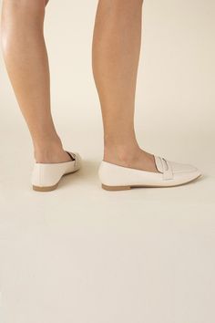 Put your feet up in style with the Harriet Loafers. These classic casual flats offer a comfortable and trendy alternative to heels. With a playful, relaxed tone, these simple yet chic flats are perfect for any casual occasion. Loafers fit true to size Elegant Everyday Slip-ons With Flat Heel, Spring Business Casual Slip-ons With Cushioned Footbed, Spring Business Casual Flat Slip-ons, Business Casual Cushioned Slip-on Flats, Spring Workwear Slip-on Moccasins, Spring Business Casual Slip-ons, Trendy Flat Heel Slip-ons For Work, Comfortable Slip-on Loafers With Pointed Toe, Casual Pointed Toe Slip-ons With Cushioned Footbed