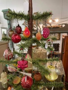 a christmas tree with ornaments hanging from it