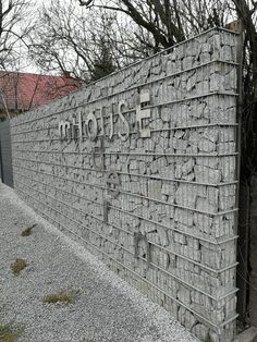 a stone wall with the word mohouse written on it