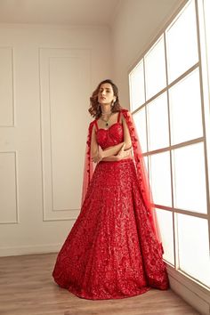 Elevate Your Style: Stunning Red Lehenga Set with Sequin Embroidery - Experience elegance with our glamorous red lehenga and bralette blouse. Adorned with red sequins throughout, this ensemble exudes royal charm. Paired with a matching sequined net dupatta, this outfit is perfect for making a statement. @studioirisindia Indian Wedding Dress Bridal Lehenga, Orang India, Baju Kahwin, Lehenga Red, Lehnga Dress, Organza Blouse, Gaun Fashion