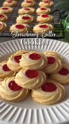 some cookies are sitting on a white plate