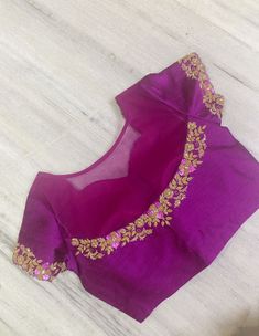 Beautiful deep magenta color pure raw silk blouse with high neck , semi circle net on the back half way through, with gorgeous antique gold embroidered for the neckline, sleeves and back. Cutwirk on the sleeves and front neckline. Size 40 with extra 2 inch margin to open Great for parties, festivals,  weddings or formal dinners You may pair it with any plain saree or textured saree to elevate the beaof this blouse!  DM if you have any questions. Plain Net Blouse Designs, Magenta Blouse Designs, Party Blouse With Dori Work In Raw Silk, Party Raw Silk Blouse With Dori Work, Elegant Dola Silk Tops For Festive Occasions, Elegant Festive Dola Silk Tops, Elegant Resham Embroidered Dola Silk Tops, Elegant Dola Silk Tops With Resham Embroidery, Festive Embroidered Dola Silk Top