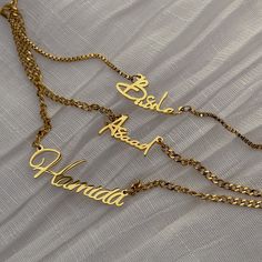 Personalize your style with our Mini Dainty Cuban Name Necklace, crafted from high-quality gold or silver-plated stainless steel. Delicately designed, this necklace features your name elegantly spelled out, adding a touch of personality to any look. The adjustable chain ensures the perfect fit, making it a versatile accessory for any neckline. Whether you're treating yourself or gifting it to someone special, our Custom Dainty Cuban Name Necklace is the perfect way to celebrate individuality and style. Make a statement with a personalized touch that's sure to be cherished for years to come. Stainless Steel 18k Gold, Silver or Rose Gold Plated Waterproof and Tarnish-free Choose your own font style HOW TO ORDER IN 3 EASY STEPS Choose your necklace color and chain length. Chains include a 2 i Elegant Personalized Stainless Steel Chain Necklace, Elegant Name Necklace With Adjustable Chain, Elegant Metal Name Necklace With Adjustable Chain, Elegant Personalized Metal Name Necklace, Personalized Elegant Stainless Steel Name Necklace, Elegant Stainless Steel Custom Name Necklace, Adjustable Personalized Gold Name Necklace, Elegant Metal Name Necklace For Anniversary, Elegant Silver Chain Necklace With Custom Name