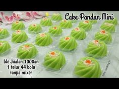 cake pandan minis in plastic trays with flowers on the table behind them