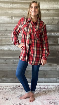 also available in a khaki plaid that is perfect for all your fall festivities! a red plaid button down flannel shirt that is giving holiday hallmark vibes! it's a versatile piece to add to your fall and holiday wardrobe. it's a long tunic length so it will pair perfectly with leggings, offering plenty of coverage. it can also be styled as a layer over a thinner top and jeans left unbuttoned in jacket mode. or layer under a neutral vest. or add a belt to cinch up the waist. wear it to a fall fest Christmas In The Country, Top And Jeans, Fall Festivities, Fall Fest, Family Holiday Photos, Graphic Tee Dress, Holiday Wardrobe, Judy Blue Jeans, Long Tunic