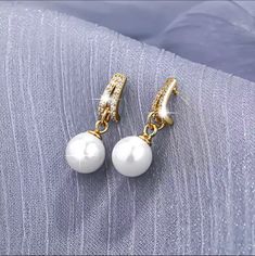 High quality Sterling Silver 18K gold plated beaded Pearl Earrings. It's beautiful, Elegant, Stylish, Trendy, Chic, Dainty and Unique earrings. It's cute earrings to wear for all occasions Party, Anniversary, Birthday Part, Wedding etc. Also, it's a great for sister, mother, female friends, wife, girlfriend and daughter. Description: Beaded Pearl, Sterling Silver, 18K Gold Plated weight is 1.79g/pair, Pearl is 7.0mm, height is 8.5mm and length is 4mm. I only offer high quality items and doing my best to keep the prices as affordable as possible for everyone. I love jewelry and fashion and really enjoy making other people happy, so am working really hard to offer a high-quality jewelry with affordable price since high quality jewelry are very expensive. All items are made with love and will Elegant Gold Plated Round Bead Earrings, Elegant Gold Plated Earrings With Round Beads, Elegant Hoop Earrings With Pearl Drop, Elegant Gold Beaded Pearl Earrings, Elegant Round Bead Clip-on Earrings For Party, Gold Earrings With Pearl Drop, Gold Earrings With Pearl Drop And Round Beads, Elegant Party Clip-on Earrings With Round Beads, Elegant Gold Hoop Earrings With Pearl Pendant