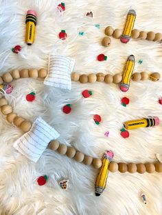 the beads are made to look like pencils and paper machines on a white furnishing