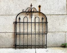 an iron cage on the side of a building