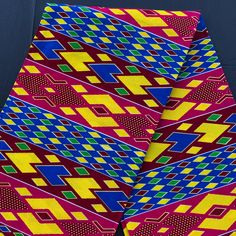 THIS IS A COTTON PRINT FABRIC INSPIRED BY KENTE DESIGN, THIS IS NOT HAND WOVEN KENTE CLOTH. -Sold in 6 continuous yards. "1" represents 6 yards -Sold in only 6 yards increments. If you need more than 6 yards, please send me a message and i'll check on availability. -Width is 44-45 inches -Hand wash with cold water, Hang or air dry -Color may be slightly different on your monitor -Can be used in sewing or craft projects -If you purchase more than one yard, you will receive one continuous piece. - Kente Cloth, Ankara Fabric, African Print Fabric, African Fabric, Gold Glitter, African Print, Printing On Fabric, Craft Projects, Hand Weaving