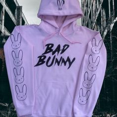 Brand New (Nwot) Bad Bunny Hoodie (Light Pink) With Bad Bunny On The Front, Bunny Ears On The Hood And Bunnies Down The Sleeves (Black). Trendy Pink Hoodie With Ribbed Cuffs, Urban Pink Hoodie For Streetwear, Cute Purple Cotton Hoodie, Cute Pink Hoodie For Streetwear, Pink Long Sleeve Hoodie With Ribbed Cuffs, Pink Long Sleeve Sweatshirt With Drawstring Hood, Pink Winter Hoodie, Pink Hooded Hoodie With Letter Print, Cute Pink Sweatshirt With Ribbed Cuffs