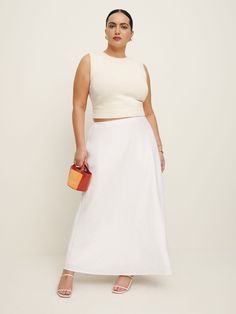 Let your skirt do the talking.  Shop the Layla Linen Skirt ES from Reformation, a bias cut, midi skirt with an elasticated waist. Skirt Midi Outfit, Midi Outfit, Linen Skirt Midi, Linen Midi Skirt, Essential Dress, Swimming Outfit, Skirt Midi, Linen Skirt, Outerwear Sweater