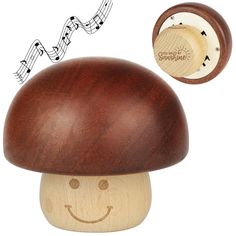 a wooden toy with music notes coming out of it's mouth and an image of a smiling mushroom