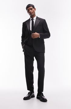 A skinny fit enhances the contemporary appeal of this tuxedo jacket classically detailed with contrast lapels. 30 1/2" length (size 42r) One-button closure Notched lapels Nonfunctional four-button cuffs Chest welt pocket; front flap pockets Partially lined 77% polyester, 17% viscose, 6% elastane Machine wash, line dry Imported Tuxedo Blazer With Hidden Button Closure For Black Tie, Black Tie Tuxedo Blazer With Hidden Button Closure, Notch Lapel Tuxedo For Black-tie Events, Fitted Single Breasted Blazer For Black-tie Events, Fitted Single-breasted Blazer For Black-tie Events, Black Tuxedo Sport Coat With Hidden Buttons, Black Tuxedo With Hidden Button Closure For Black Tie, Black Tuxedo Suits With Structured Boning, Black Tie Tuxedo Blazer With Notch Lapel