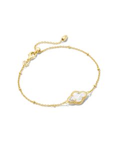 Our iconic medallion—representing joy, optimism, possibility, and femininity—gets reimagined in the Abbie Gold Satellite Chain Bracelet in Ivory Mother-of-Pearl. With its elegant and elongated stone and subtle satellite chain detailing, it’ll be the perfect addition to your bracelet stack.,Metal14k Gold Over BrassMaterialIvory Mother-Of-PearlClosureLobster claspSize8L, 0.41WDue to the one-of-a-kind nature of the medium, exact colors and patterns may vary slightly from the image shown.} | Kendra Cute Gold Bracelet, Cute Jewelry Silver, Enewton Jewelry, Bracelet Words, Kendra Scott Bracelet, Surf Jewelry, Preppy Jewelry, Cute Bracelet, Luxury Jewelry Brands