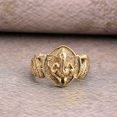 Antique Gold Ganesha Finger Ring , Party Wear Rings , Temple Jewelry , Finger Rings , Spiritual Jewelry ❥ Customers satisfaction is our biggest priority, please contact us with any questions/queries for future or existing orders, and we will do our best to make sure you are happy with your order. ❥Please make sure to add the correct address during check out. You can return your purchased item within 15 days after successful delivery. We offer a 100% "Money Back Guarantee" if you are not satisfied with your purchase. Return charges will be paid by buyers only! ❥ Please share your numbers (in personalization box ) as required for shipping address details, and it'll help us to contact you easily. And don't worry about the privacy, we'll keep it safe with us, So try to cooperate with us. :) Yo Gold Rings As Diwali Gifts, Gold Rings For Diwali Gift, Gold Rings For Puja And Festivals, Temple Jewelry Rings For Festivals And Puja, Temple Jewelry Style Rings As Diwali Gift, Temple Jewelry Rings For Puja And Festivals, Gold Rings Suitable For Festivals Or Gifts, Gold Rings For Festivals, Intricate Design Rings For Festivals Gift