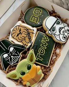 star wars decorated cookies in a box on a table