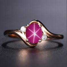 14k Rose Gold Pink Star Sapphire Ring, Lindy Star Sapphire, 925 Sterling Silver, Star Gemstone, Lindy Star Ring, Star Sapphire Jewelry ★ Settings ☆ Metal - 925K Sterling Silver/ 14k Rose Gold ☆ band Color - Rose / White / Yellow ⍟ The ring size shown in the pictures is 7 US. ★ Main Stone ☆ Stone - Lab Created Pink star sapphire ☆ Size - 6×8 mm ☆ Shape - Oval ☆ Color Grade- AAA ☆ Certificate of Authenticity and lifetime warranty by Dkjewelrystore ☆ Side Stone - Round CZ Diamonds ★ Features : ☆ Ha Lindy Star Ring, Lindy Star Ring Sapphire, Star Saphires, Star Sapphire Engagement Ring, Star Sapphire Jewelry, Yellow Sapphire Ring Engagement, Star Sapphire Gemstone, Pink Gemstone Ring, Oval Sapphire Engagement Ring