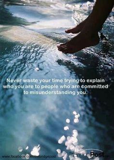 a person's feet in the water with a quote on it that says never waste your time trying to explain who you are to people who are